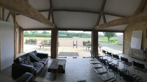 Fitting toughened glass to pool barn. view from inside.